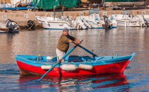 A fisherman in Gallipoli brings in the day's catch for use at Castello di Ugento restaurant Il Tempo Nuovo